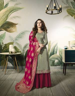 Grab This Beautful Designer Plazzo Suit In Pastel Green Colored Top Paired With Contrasting Rani Pink Colored Bottom And Dupatta,Its Top Is Fabricated On Satin Silk Paired With Santoon Bottom And Banarasi Jacquard Silk Dupatta. 