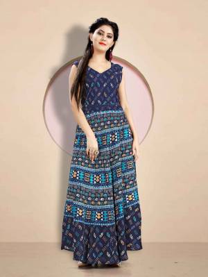 Here Is A Very Pretty Long Kurti For These Summer In Navy Blue Color Fabricated Rayon. It Is Beautified With Prints All Over. Buy Now.