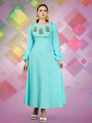 For Your Semi Casuals, Grab This Designer Readymade Kurti In Sky Blue Color Fabricated On Rayon, It Has Attractive Yoke With Prints And Lace Border. Buy Now.
