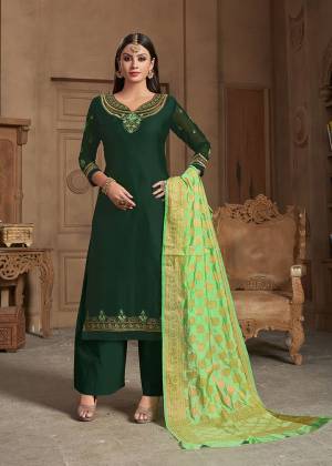 Celebrate This Festive Season Wearing This Designer Straight Suit In Dark Green Color Paired With Light Green Colored Dupatta. Its Top Is Fabricated On Satin Georgette Paired With Santoon Bottom And Banarasi Silk Dupatta. Buy This Suit Now.