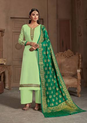 Summer Is All About Colors, Grab This Beautiful Designer Straight Suit In Pastel Green Color Paired With Green Colored Dupatta, Its Embroidered Top Is Fabricated On Satin Georgette Paired With Santoon Bottom And Banarasi Silk Dupatta.Buy This Suit Now.