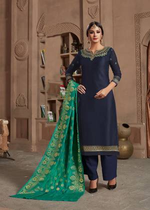 Enhance Your Personality In This Designer Navy Blue Colored Straight Suit Paired With Contrasting Sea Green Colored Dupatta. It Is Fabricated Satin Georgette Paired With Santoon Bottom And Banarasi Silk Dupatta. Its Top IS Beautified With Attractive Elegant Embroidery. 