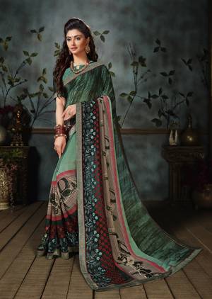 Add Some Casuals With This Pretty Georgette Based Saree Beautified With Prints. It Is Light In Weight As It Is Weightless Fabric Which Also Perfect For Summer. Buy Now.