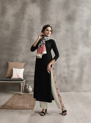 Enhance Your Personality In This Rich Color Pallete With This Designer Readymade Kurti Set In Black Color paired With Off-White Colored Plazzo And Multi Colored Scarf. Its Top And Bottom are Rayon Fabricated Paired With Soft Cotton Scarf. It Has Pretty Thread Work Over Plazzo And Printed Scarf. 