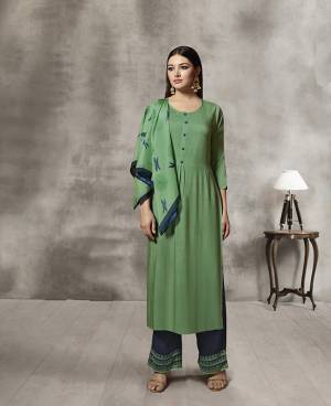 Celebrate This Festive Season Wearing Designer Readymade Plazzo Set In Green Colored Kurti Paired With Contrasting Navy Blue Colored Plazzo And Green Colored Scarf. Its Top And Bottom Are Rayon Based Paired With Soft Cotton Scarf. Buy Now.