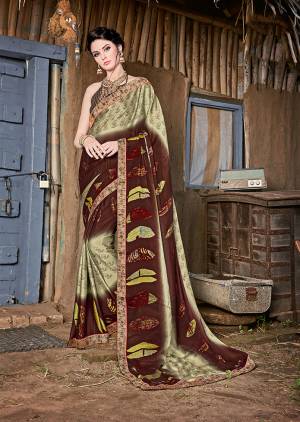 Grab This Beautiful Printed Saree For Semi-Casuals. This Saree And Blouse Are Fabricated On Magic Chiffon Beautified With Prints And Lace Border. It Is Light Weight And Easy To Carry All Day Long. 