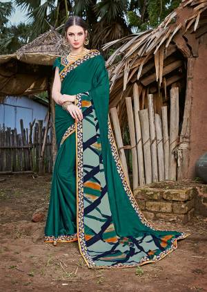 Here Is A Very Pretty For Your Casual Or Semi-Casual Wear. This Saree And Blouse Are Fabricated On Magic Chiffon Beautified With prints And Lace Border. Buy Now.