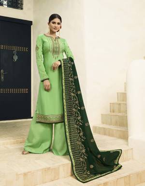 Celebrate This Festive Season With Ease And Comfort Wearing This Designer Straight Cut Suit In Green Color Paired With Dark Green Colored Dupatta. Its Top Is Fabricated On Satin Georgette Paired With Santoon Bottom And Georette Fabricated Dupatta. All Its Fabric Are Light Weight And Easy To Carry All Day Long. 