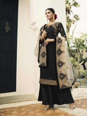 For A Bold And Beautiful Look, Grab This Designer Straight Cut Suit In Black Colored Top And Bottom Paired With Grey Colored Dupatta. Its Top Is Fabricated On Satin Georgette Paired With Santoon Bottom And Embroidered Net Fabricated Dupatta.  