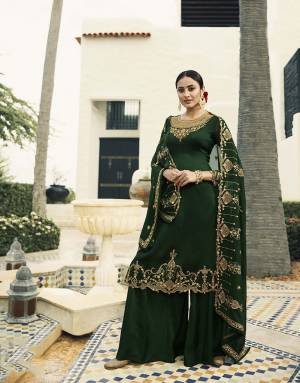 Enhance Your Personality Wearing This Designer Straight Suit In Dark Green Color. This Heavy Embroidred Suit Is All Occasion Wear, Its Top Is Fabricated On Satin Georgette Paired With Santoon Bottom And Georgette Fabricated Heavy Embroidered Dupatta. 