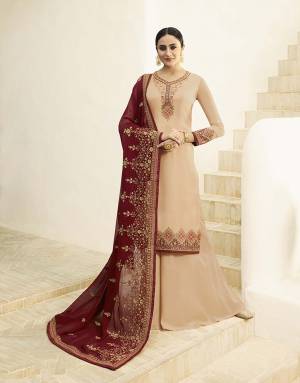 Celebrate This Festive Season With Ease And Comfort Wearing This Designer Straight Cut Suit In Beige Color Paired With Maroon Colored Dupatta. Its Top Is Fabricated On Satin Georgette Paired With Santoon Bottom And Georette Fabricated Dupatta. All Its Fabric Are Light Weight And Easy To Carry All Day Long. 