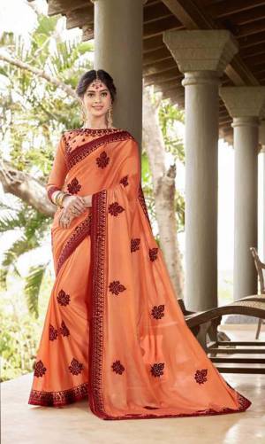 Shine Bright In This Designer Orange Colored Saree Paired?With Orange Colored Blouse. This Saree Is Georgette Based Paired With Art Silk Fabricated Blouse Beautified With Contrasting Thread Embroidery And Stone Work