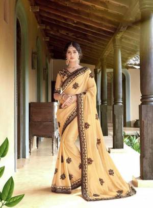 Rich And Elegant Looking Designer Saree Is Here In Beige Color Paired With Beige Colored Blouse. This Saree Is Georgette Based Paired With Art Silk Blouse, Beautified With Thread Embroidery And stone Work .It Is Light Weight And Easy To carry All Day Long.