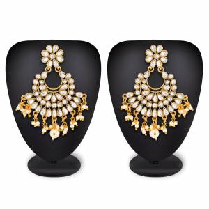 For Your Heavy Traditionals, Grab This Beautiful And Attractive Looking Earrings Set In Golden Color Beautified With Stone Work. This Can Also Be Paired With Any Colored Attire.
