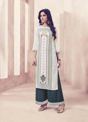 Simple And Elegant Looking Designer Readymade Set Of Kurti And Plazzo Is Here In White Colored Top Paired With Teal Blue Colored Bottom. Both The Top And Bottom Are Rayon Based Which Is Soft Towards Skin And Ensures Superb Comfort All Day Long. 