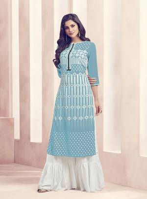 Look Pretty In This Designer Readymade Kurti Plazzo Set. Its Pretty Kurti Is In Sky Blue Color Paired With White Colored Bottom. Both The Readymade Top And Bottom Are Rayon Based Beautified With Prints. 