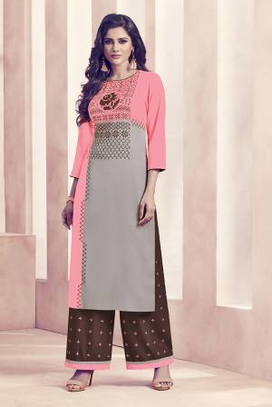 Add Some Beautiful Semi-Casuals to Your Wardrobe With This Designer Readymade Kurti And Plazzo. The Top Is In Pink And Grey Color Paired With Brown Colored Bottom. It Is Rayon Based Beautified With Prints. Buy Now.