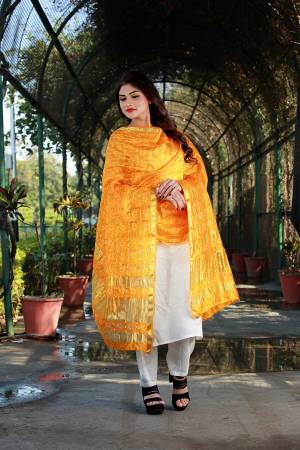 Add This Pretty Dupatta To Your Wardrobe For Your Semi-Casuals Or Festive Wear. This Pretty Dupatta Is Fabricated On Poly Chiffon Silk Beautified With Bandhani Prints All Over, Buy Now.