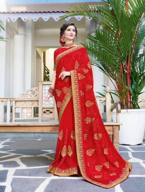Shine Bright In This Designer Red Colored Saree Paired With Red Colored Blouse. This Saree Is Georgette Based Paired With Art Silk Fabricated Blouse Beautified With Contrasting Thread & Jari Embroidery With Stone Work
