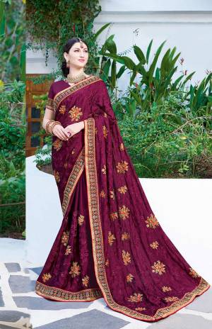 Rich And Elegant Looking Designer Saree Is Here In Wine Color Paired With Wine Colored Blouse. This Saree Is Georgette fabricated Beautified With Thread Embroidery And stone Work .It Is Light Weight And Easy To carry All Day Long