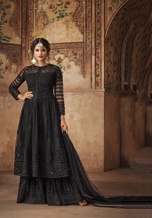 For A Bold and Beautiful Look, Grab This Designer Heavy Sharara Suit In Black Color. It Is Fabricated On Net Beautified With Heavy Tone To Tone Embroidery And Stone Work.