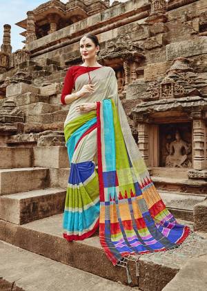 Go Colorful With This Designer Printed Saree In Mutli Color Paired With Red Colored Blouse. This Saree And Blouse are Fabricated On Khadi Silk Beautified With Prints. 