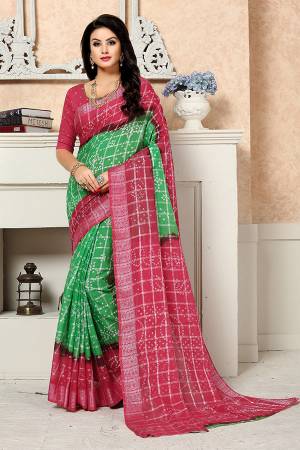 For A Proper Traditional Look, Grab This Designer Bandhani Printed Saree In Green And Pink Color Paired With Pink Colored Blouse. This Saree Is Georgette Based Paired With Art Silk Fabricated Blouse. Buy Now.