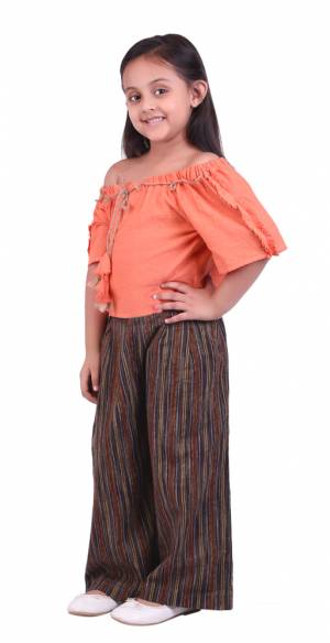 Be It Party Wear Or For An Outing This Lovely Pair Of Top And Pants Is Suitable For All. Its Top Is In Orange Color Paired With Brown Colored Bottom. This Khadi Cotton Based Dress Is Available In Sizes, Choose As Per Your Desired Comfort. Buy Now