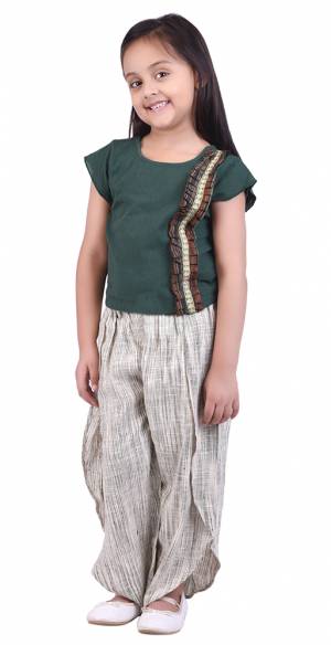 Pretty Simple Pair In Top And Pant Is Here In Teal Green Colored Top Paired With  Cream Colored Bottom. This Pair Is Khadi Cotton Based Which Is Suitable For All Season And Ensures Superb Comfort. Buy Now