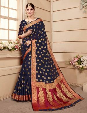 Celebrate This Festive Season Wearing This Saree In Navy Blue Color. This Saree And Blouse Are Fabricated On Banarasi Art Silk. Beautified With Weave All Over. Its Attractive Color And Weave Will Earn You Lots Of Compliments From Onlookers. 