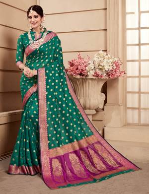 Celebrate This Festive Season Wearing This Saree In Teal Green Color. This Saree And Blouse Are Fabricated On Banarasi Art Silk. Beautified With Weave All Over. Its Attractive Color And Weave Will Earn You Lots Of Compliments From Onlookers. 