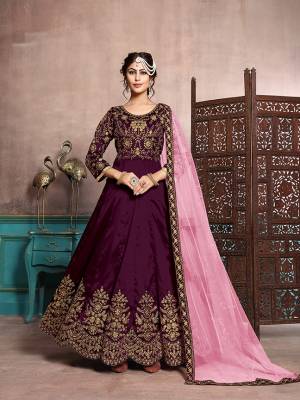 Here Is A Beautiful Designer Floor Length Suit In Wine Color Paired With Wine Colored Bottom And Pink Colored Dupatta. Its Heavy Embroidered Top Is Fabricated On Art Silk Paired With Santoon Bottom And Net Fabricated Dupatta. Its Has Attractive Embroidery Over The Yoke, Panel And Dupatta Lace Border. 