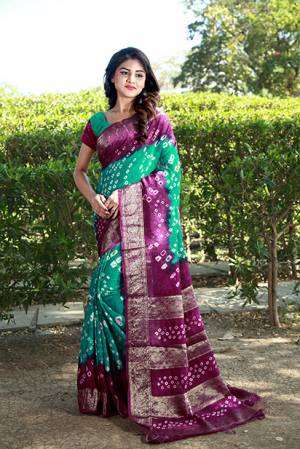 Add Some Casuals With This Beautiful Cotton Based Saree. This Saree And Blouse Are Fabricated On Art Cotton Beautified With Pretty Bandhani Prints All Over. Buy This Pretty Saree Now.