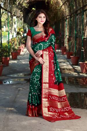 Add Some Casuals With This Beautiful Cotton Based Saree. This Saree And Blouse Are Fabricated On Art Cotton Beautified With Pretty Bandhani Prints All Over. Buy This Pretty Saree Now.