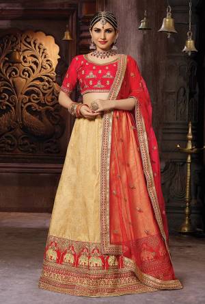 Evergreen Combination Is Here With This Designer Lehenga Choli In Red And Beige Color. This Lehenga Choli Is Silk Based Paired With Net Fabricated Dupatta. Buy This Designer Piece Now.