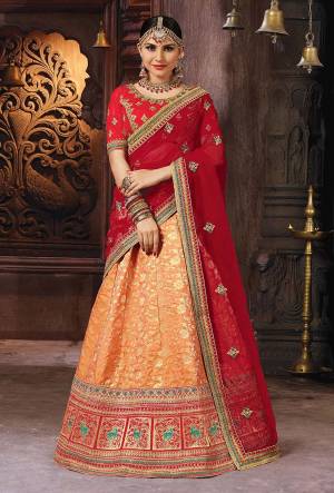 For A Proper Traditional Look, Grab This Designer Lehenga Choli In Red And Orange Color. Its Blouse Is Fabricated On Art Silk Paired With Banarasi Art Silk Lehenga And Net Fabricated Dupatta. 