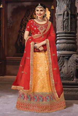 For A Proper Traditional Look, Grab This Designer Lehenga Choli In Red And Orange Color. Its Blouse Is Fabricated On Art Silk Paired With Banarasi Art Silk Lehenga And Net Fabricated Dupatta. 