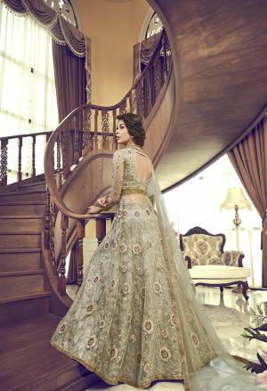 This season Is About Subtle Shades And Pastel Play So Grab This Designer Indo-Western Suit In Pastel Green. Its Heavy Embroidered Top IS Net Based Paired With Silk Fabricated Embroidered Bottom And Net Dupatta. 