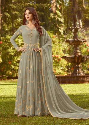 Flaunt Your Rich And Elegant Taste In This Designer Floor Length Suit In Grey Color. This Pretty Suit Is Georgette Based Beautified with Jari And Thread Work. Buy This Suit Now.