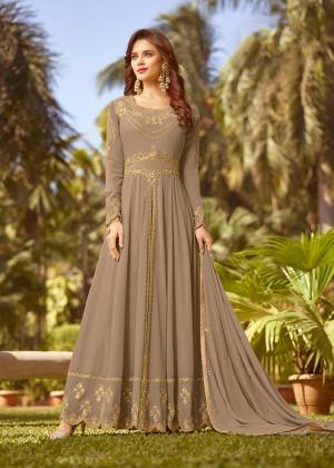 Celebrate This Festive Season With Rich Color And Fabric Wearing This Designer Floor Length Suit In Sand Grey Color. Its Top And Dupatta Are Fabricated On Georgette Paired With Santoon Bottom. Buy Now.