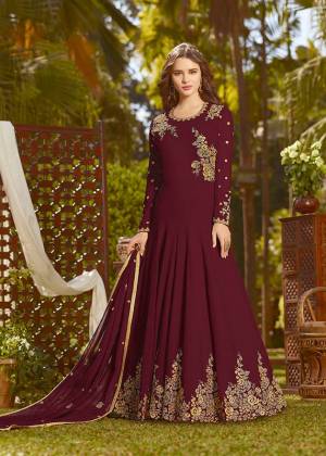 Eye Catchy And Trendy Color Is Here With This Designer Floor Length Suit In Maroon Color Paired With Maroon Colored Bottom And Dupatta. Its Top And Dupatta Are Fabricated On Georgette Paired With Santoon Bottom. It Is Beautified With Attractive Embroidery. Buy Now.