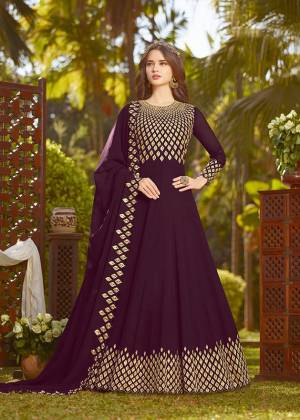Enhance Your Personality Wearing This Heavy Designer Floor Length Suit In Rich Wine Color Paired With Wine Colored Bottom And Dupatta. It Top And Dupatta Are Georgette Fabricated Beautified With Heavy Embroidery Paired With Santoon Fabricated Bottom. Buy This Semi-Stitched Suit Now.