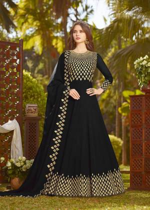 Enhance Your Personality Wearing This Heavy Designer Floor Length Suit In Black Color Paired With Black Colored Bottom And Dupatta. It Top And Dupatta Are Georgette Fabricated Beautified With Heavy Embroidery Paired With Santoon Fabricated Bottom. Buy This Semi-Stitched Suit Now.