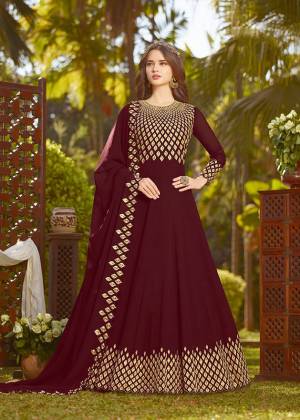 Enhance Your Personality Wearing This Heavy Designer Floor Length Suit In Rich Maroon Color Paired With Maroon Colored Bottom And Dupatta. It Top And Dupatta Are Georgette Fabricated Beautified With Heavy Embroidery Paired With Santoon Fabricated Bottom. Buy This Semi-Stitched Suit Now.