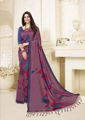 Look Pretty In This Silk Based Pink Colored Saree Paired With Contrasting Blue Colored Blouse. It Is Beautified With Geometric Prints and Also It Is Light In Weight And Easy To Drape. Buy Now. 