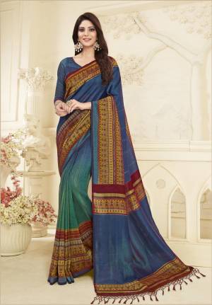 Cool Color Pallete Is Here With This Printed Saree In Blue And Green Color Paired With Blue Colored Blouse. This Saree And Blouse are Fabricated On Art Silk Beautified With Prints. 