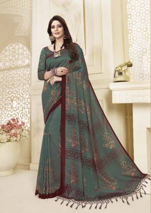 Enhance Your Personality Wearing This Lovely Saree In Teal Green Color Paired With Teal Green Colored Blouse. This Saree And Blouse Are Silk Beautified With Contrasting Colored Prints All Over It. 