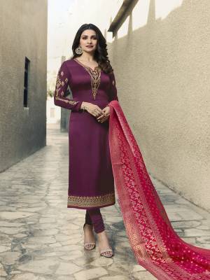 Add This Beautiful Shade To Your Wardrobe With This Designer Straight Cut Suit In Wine Color Paired With Contrasting Dark Pink Colored Dupatta. Its Pretty Embroidedred Top Is Fabricated On Satin Georgette Paired With Santoon Bottom And Banarasi Silk Dupatta. Buy It Now.