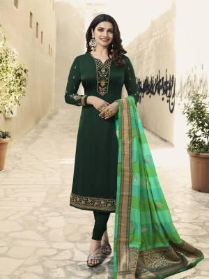 Go With The Shade Of Green With This Designer Straight Suit In Dark Green Colored Top And Bottom Paired With Green Colored Dupatta. Its Top Satin Georgette Based Beautified With Attractive Embroidery Paired With Santoon Bottom And Banarasi Art Silk Dupatta. 
