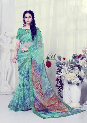 This Festive Season, Celebrate With Beauty And Comfort Wearing This Printed Saree. This Saree Is Fabricated On Georgette Brasso Paired With Art Silk Fabricated Blouse. It Is Beautified With Prints And Lace Border. Buy Now.